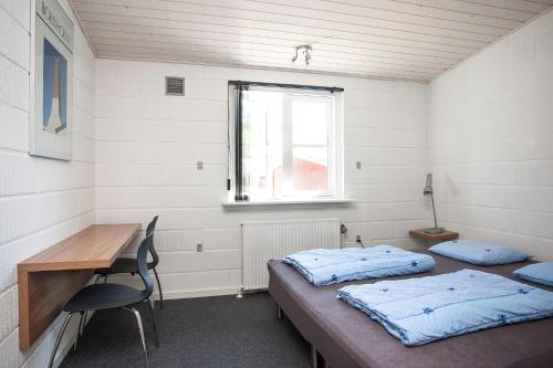 Postel nebo postele na pokoji v ubytování Dueodde Hostel
