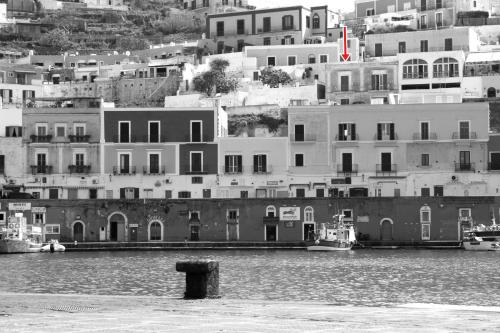 a black and white photo of a city with buildings at Maridea - Corso Umberto in Ponza
