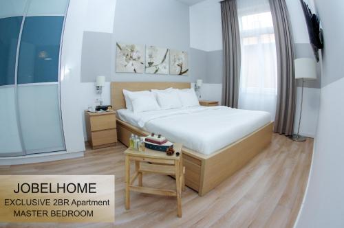 A bed or beds in a room at JobelHome