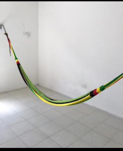 a hose hanging from a wall in a room at Casa Colonial Centro in Mérida