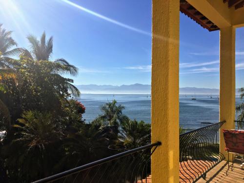 a view of the ocean from the balcony of a house at Villas Jardin Del Mar in Cruz de Huanacaxtle