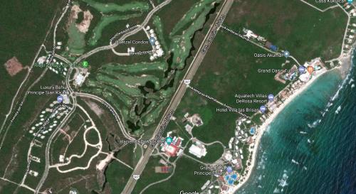 a map of a park next to the water at Quetzal Apartment in Akumal
