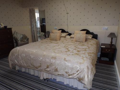 Katil atau katil-katil dalam bilik di Rosedene Guest House