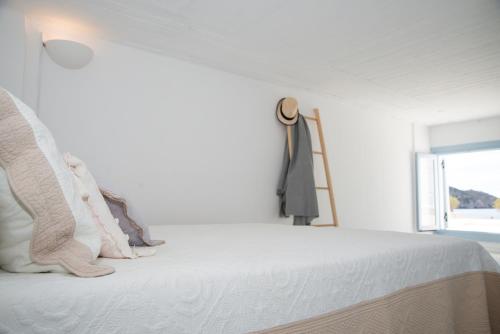 Ένα ή περισσότερα κρεβάτια σε δωμάτιο στο Patmos Sunshine Houses - Just a 5-Minute Walk from Skala Square and the Port