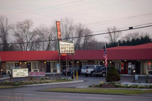a fast food restaurant with a sign in a parking lot at Tazewell Motor Lodge in Tazewell