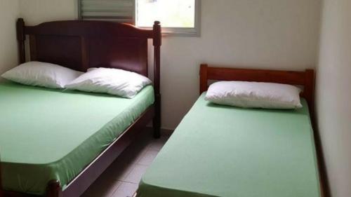 Vuode tai vuoteita majoituspaikassa Apartamento Ubatuba