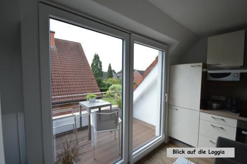 a sliding glass door with a view of a balcony at Appartement Sendenhorst in Sendenhorst