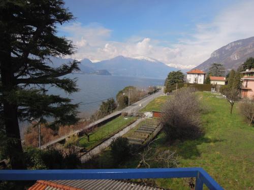 a view of a lake with a train on the tracks at Carpe Diem in Lierna