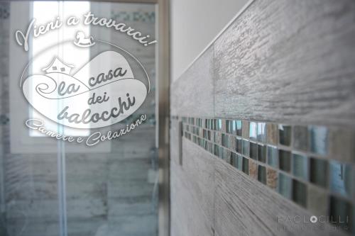a sign on a glass door of a library at La Casa dei Balocchi B&B in Toirano