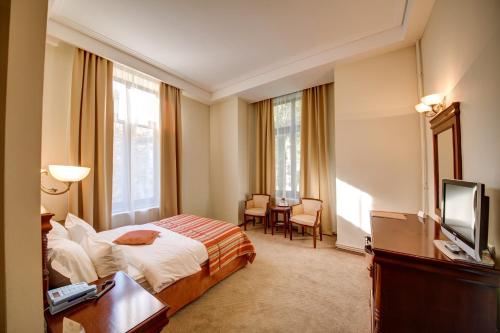 Postel nebo postele na pokoji v ubytování Atrium Hotel Ateneu City Center