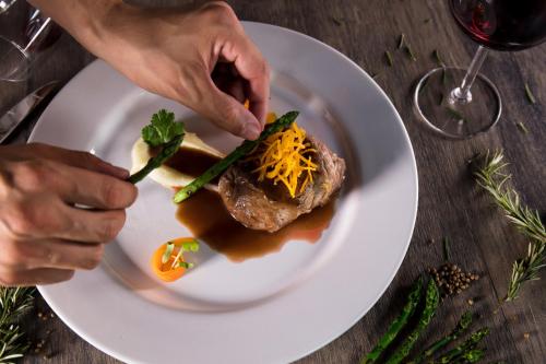 a person eating a plate of food on a table at Krystal Grand Nuevo Vallarta in Nuevo Vallarta 