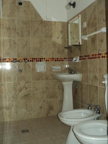 a bathroom with a sink and a toilet at La Nona in Villa Cura Brochero