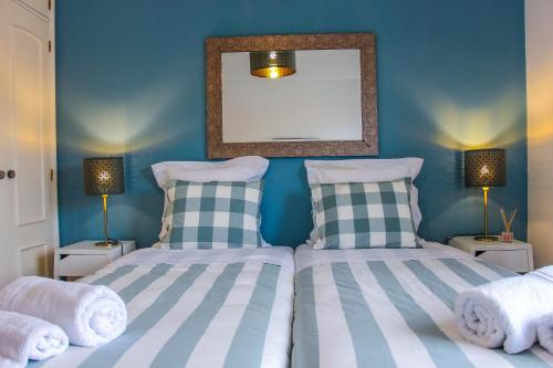 Cama o camas de una habitación en Alameda Garden