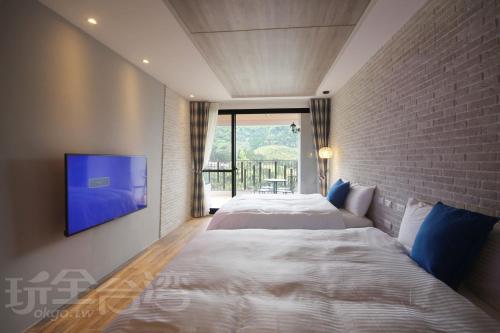 Cama o camas de una habitación en Sheng Shine Forest Resort