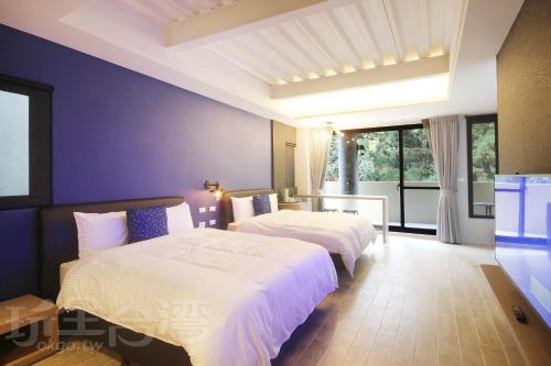 Cama o camas de una habitación en Sheng Shine Forest Resort
