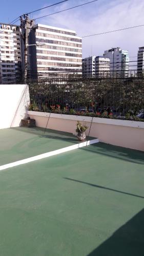 a tennis court on the roof of a building at Hostal Santa María Gracia in Quito