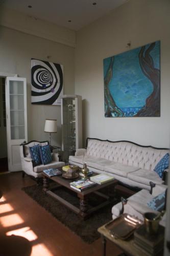 a living room with a couch and a table at Casa Falleri Boutique Hotel in Lima
