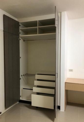 a walk in closet with stairs and a door at H12, The Stylish Apartment in Hua Hin