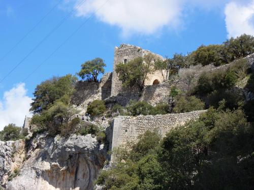 a castle on the side of a mountain at Hostal Ca'n Tiu in Alaró
