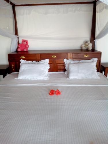 Postel nebo postele na pokoji v ubytování Thanu Beach Villa