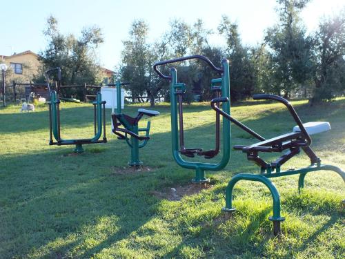a group of playground equipment in a park at Agriturismo San Martino in Ponsacco