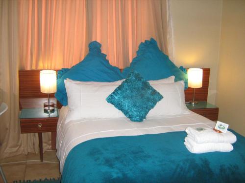 Voodi või voodid majutusasutuse Obrigado Guest House toas