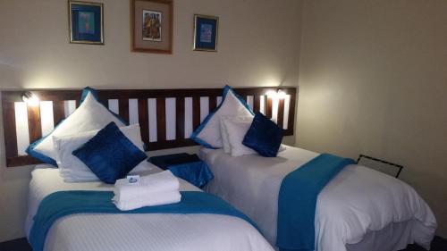 Ένα ή περισσότερα κρεβάτια σε δωμάτιο στο Obrigado Guest House