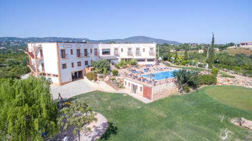 an aerial view of a villa with a swimming pool at Quinta dos Poetas Nature Hotel & Apartments in Olhão