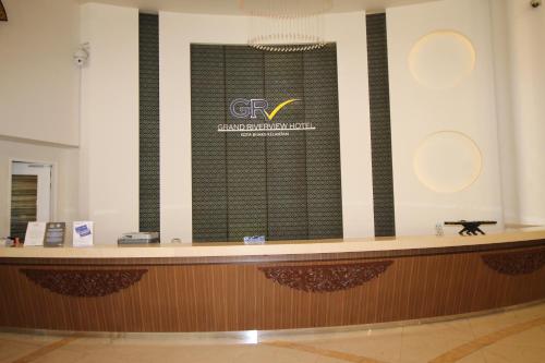 a lobby with a large window with the gpr logo on it at Grand Riverview Hotel in Kota Bharu
