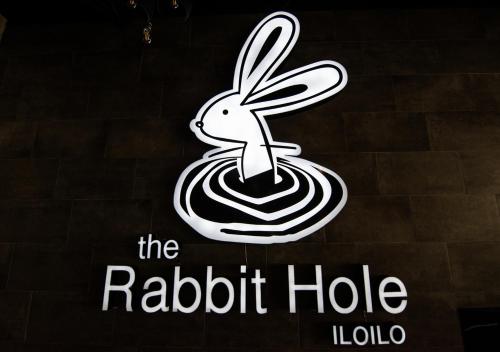 a sign for a restaurant with a rabbit in a egg at Goldberry Lite Hotel in Iloilo City