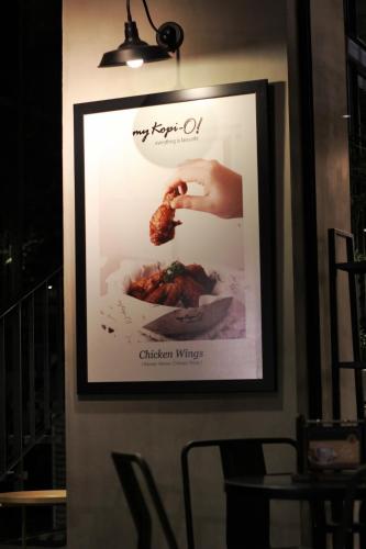a framed picture of food on a wall at Hay Bandung in Bandung