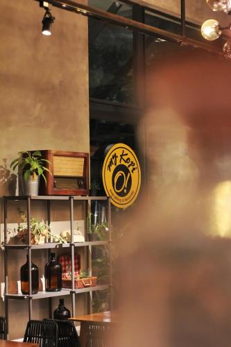 a sign on the door of a restaurant at Hay Bandung in Bandung