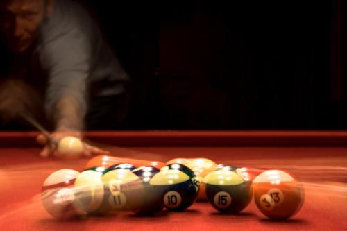 a group of billiard balls on a pool table at Hotel-Résidence Am Klouschter in Mondorf-les-Bains