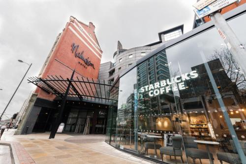 a store front of a building with glass windows at Malmaison Manchester in Manchester
