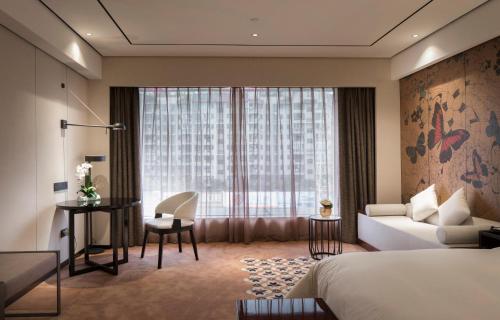 Postel nebo postele na pokoji v ubytování Paco Hotel Dongpu Guanghzou -Free Shuttle Bus for Canton Fair