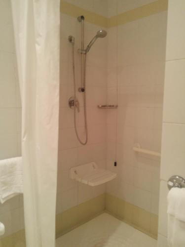 a bathroom with a shower with a toilet at Hotel Meridiana in Florence