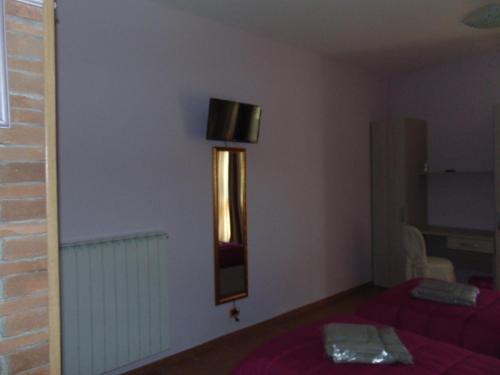 Postel nebo postele na pokoji v ubytování Agriturismo CHERUBINI DANIELA