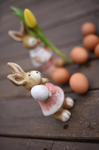 a figurine of a bunny and eggs on a table at Bungalouri Horizont in Odorheiu Secuiesc