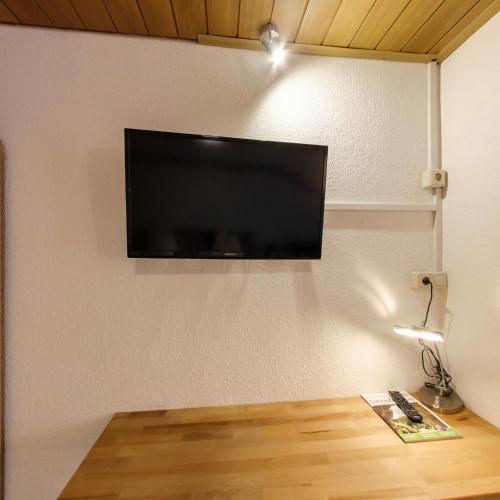 a flat screen tv hanging on a wall at Gasthof Liederhalle in Aalen
