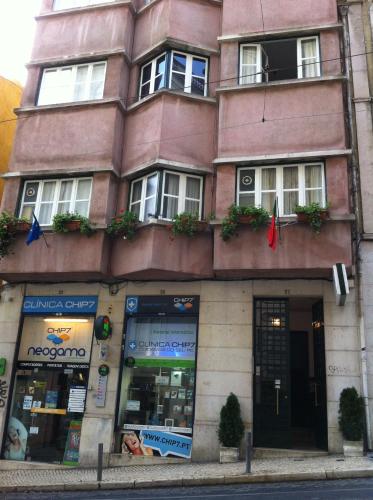 a building on the corner of a street at Residencial Valentina in Lisbon