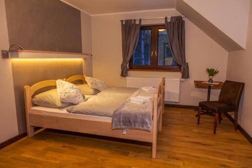 Ein Bett oder Betten in einem Zimmer der Unterkunft Gościniec Krutyński