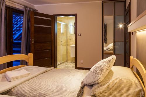 Ein Bett oder Betten in einem Zimmer der Unterkunft Gościniec Krutyński