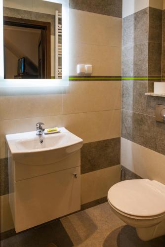 Ein Badezimmer in der Unterkunft Gościniec Krutyński