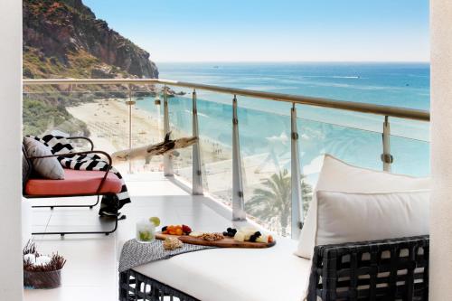 a balcony with a view of the beach at Cali Holidays - Luxury Bed & Breakfast in Sesimbra