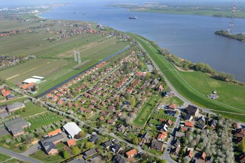 an aerial view of a city and a river at Ferienhaus Scout 42 im Feriendorf Altes Land in Hollern-Twielenfleth