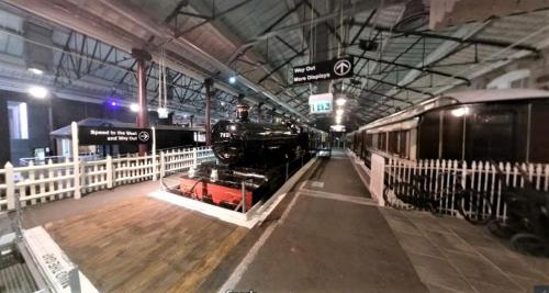 a train on display in a train station at Swindon City Centre Duplex - EnterCloud9SA in Swindon