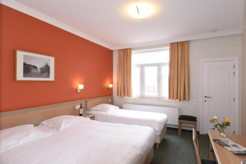 Postel nebo postele na pokoji v ubytování Hotel Sabot D'Or