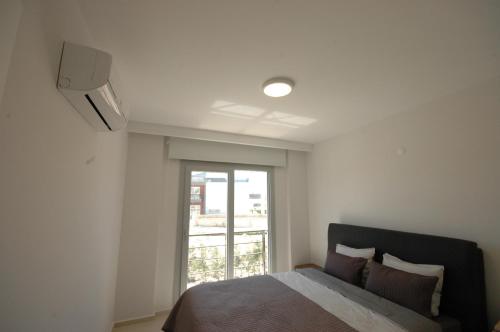 Ένα ή περισσότερα κρεβάτια σε δωμάτιο στο Lavender Residence