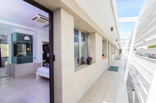 a hallway of a hospital with a glass door at JC Hotel in Rome