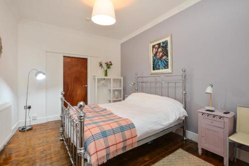 a bedroom with a bed with a metal frame at The LOCATION- 1 FREE PRIVATE PARKING SPACE - 60 SECOND WALK 2 MINSTER! in York